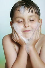 Image showing Young boy child washing cleansing face soap and water