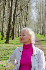 Image showing Portrait of a middle-aged woman in a spring Park  