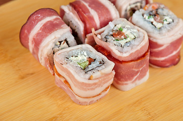 Image showing Sushi roll with bacon