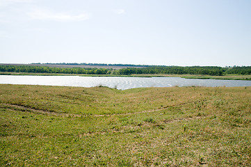 Image showing view to green meadow and little pond