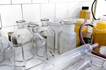 Image showing Photo of an old laboratory with a lot of bottles