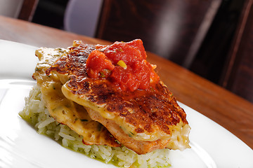 Image showing Fried chicken ribs and rice with tomato sauce