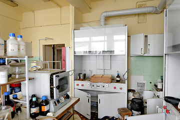 Image showing Photo of an old laboratory with a lot of bottles