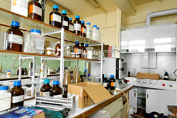 Image showing Photo of an old laboratory with a lot of bottles