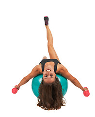 Image showing Young woman in the studio with weights