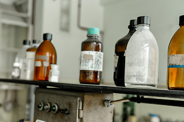 Image showing Photo of an old laboratory with a lot of bottles