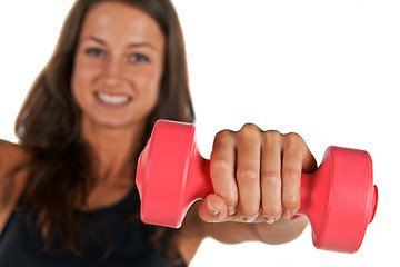 Image showing Young woman in the studio with weights