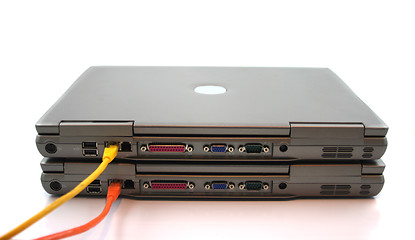 Image showing 2 Laptops with network Cables