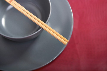 Image showing Bowl with chopsticks