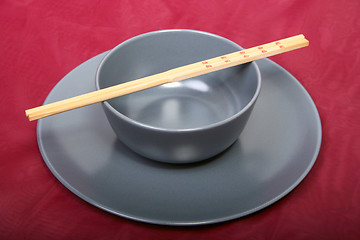 Image showing Bowl with chopsticks