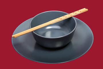 Image showing Bowl with chopsticks