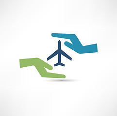 Image showing Hands and aircraft. The concept of safe flight.