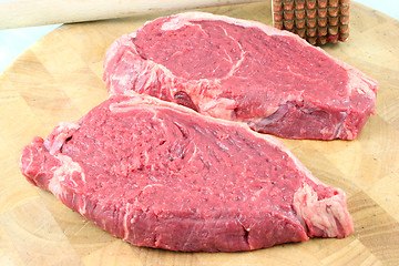 Image showing Steaks on a chopping board