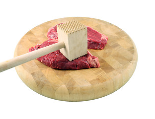 Image showing Steaks on a chopping board with Mallet