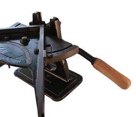 Image showing mitering machine showing knife handle