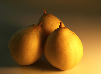 Image showing three golden pears