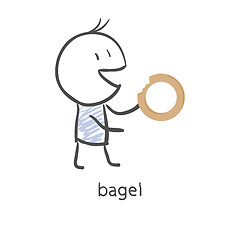 Image showing Cartoon guy eats a bagel