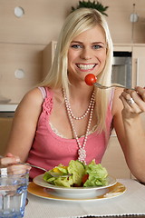 Image showing Woman eating salad