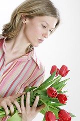 Image showing Woman holding flowers
