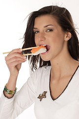 Image showing Woman eating sushi