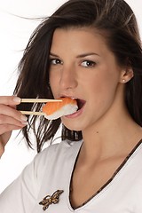 Image showing Woman eating sushi