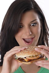 Image showing Woman eating burger