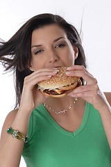 Image showing Woman eating burger