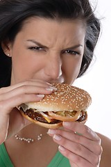 Image showing Woman eating burger