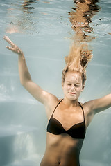 Image showing pool diving woman