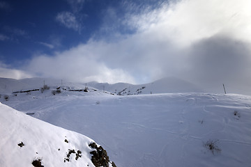 Image showing Off-piste slope and mountains in haze