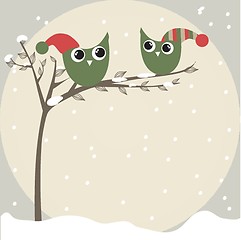 Image showing simple card illustration of two funny cartoon owls with christmas hats on a branch