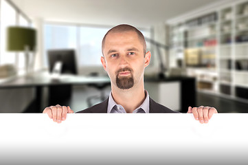 Image showing Businessman showing blank empty white billboard sign