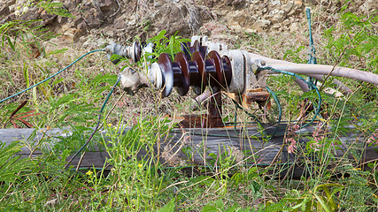 Image showing Old electric pole fallen