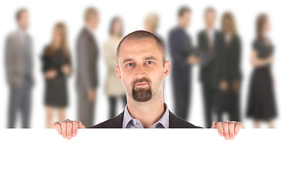 Image showing Businessman showing blank empty white billboard sign