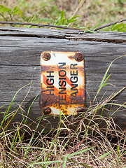 Image showing High tension danger sign on a pole