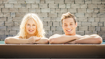 Image showing young couple at the pool