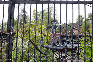 Image showing old rusty soviet gate to marine base