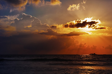 Image showing Evening landscape with sun and the rays over ocean