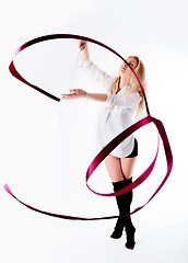 Image showing rhythmic gymnastics woman with red tape