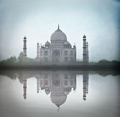 Image showing Taj Mahal in twilight trough the fog with water reflection