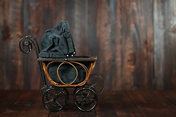 Image showing Baby Cradle on Grunge Wooden Background