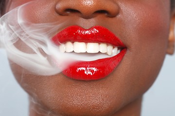 Image showing Beautiful Lips of a Woman With Cigarette Smoke