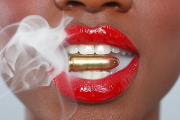 Image showing Lips of a Woman With A Bullet and Smoke