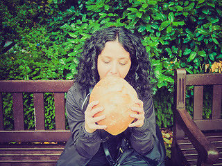 Image showing Girl eating bread