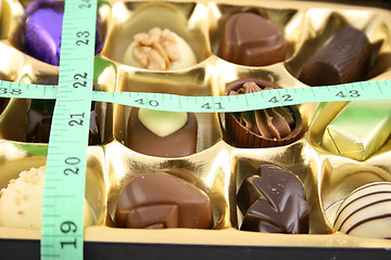 Image showing Chocolate Box - Chocs and tape measure