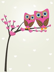 Image showing Two cute owls on the tree branch