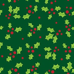 Image showing Christmas background with holly berry leaves on dark green background