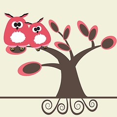 Image showing Two cute owls on the tree branch