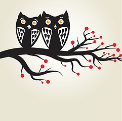 Image showing Two cute owls on the tree branch