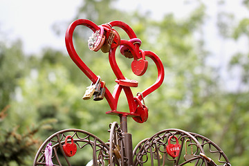 Image showing Two red hearts with iron locks